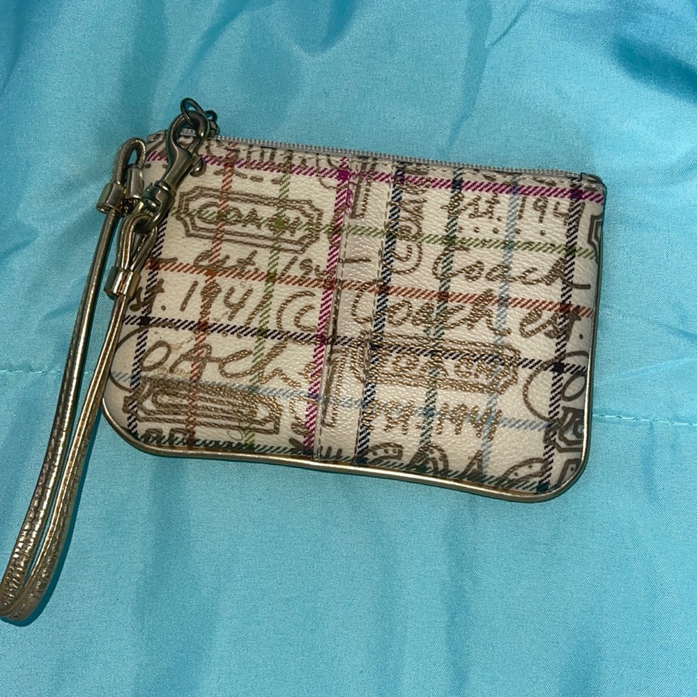 Gold coach wristlet